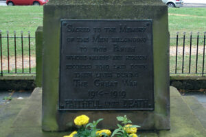 A plaque on the war memorial."