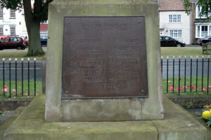 A plaque on the war memorial."