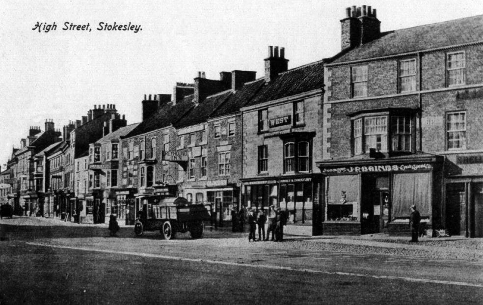 Looks like a Postcard. A view of the High Street showing what is now SPAR, Grainges, Boots, Thomas the Baker