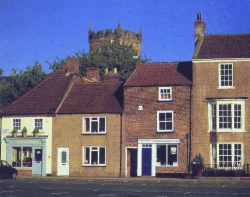 A fine corner of the High Street with the church in the background